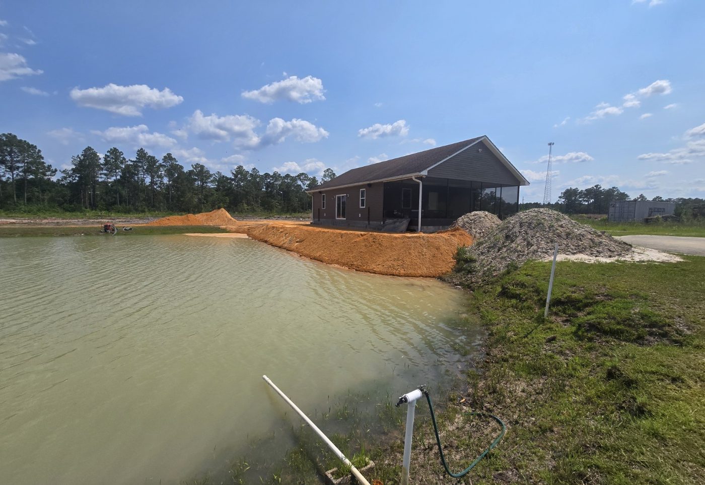 Pond bank stabilization and site restoration work in progress