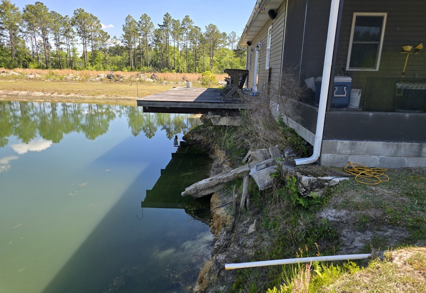 Existing shoreline erosion and undermined bank areas on the Cavagnaro pond project